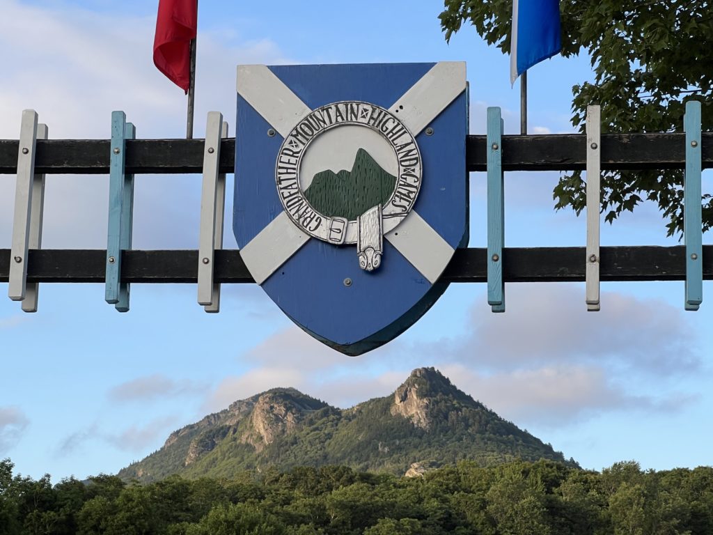 Grandfather Mountain Highland Games sign with the mountain in the background.
